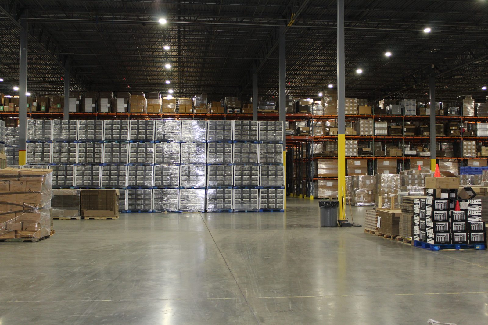 Organized pallet racking and floor storage inside Productiv Charlotte fulfillment center