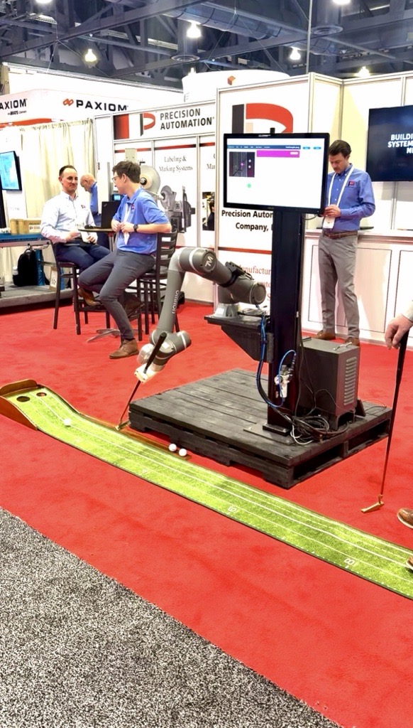 Cobot playing mini golf demonstrating precision